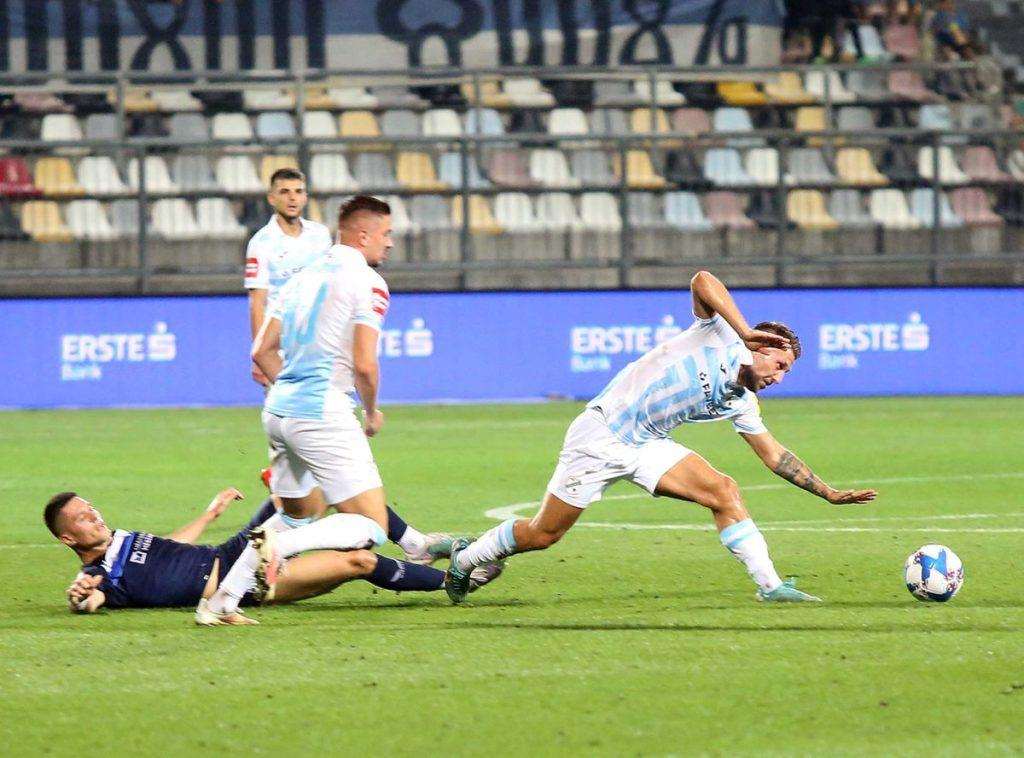 DOMINACIJA MODRIH I BIJELIH: Dinamo osvojio nova tri boda, Rijeka s dva pogotka Marka Pjace savladala Osijek DOMINACIJA MODRIH I BIJELIH: Dinamo osvojio nova tri boda, Rijeka s dva pogotka Marka Pjace savladala Osijek